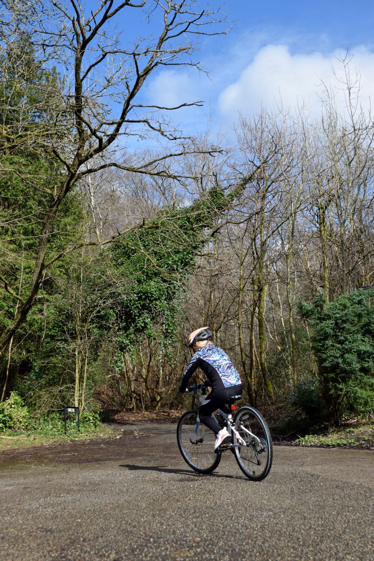 Amy riding her bike in Boggart Hole Clough