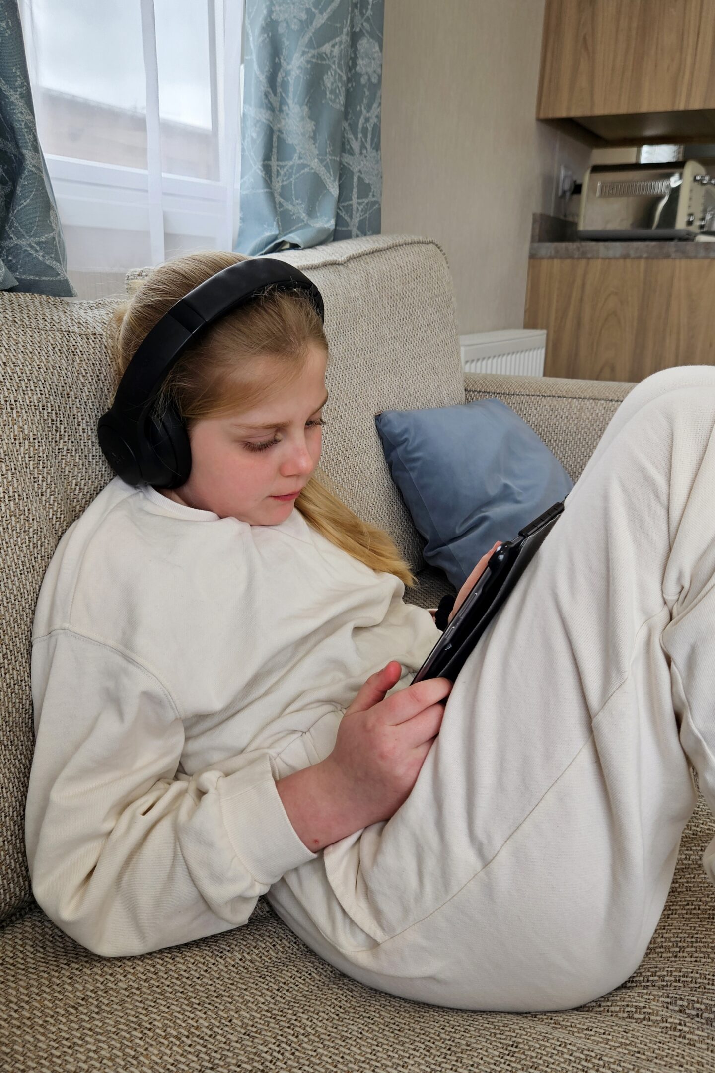 Amy chilling out on her tablet in our holiday home
