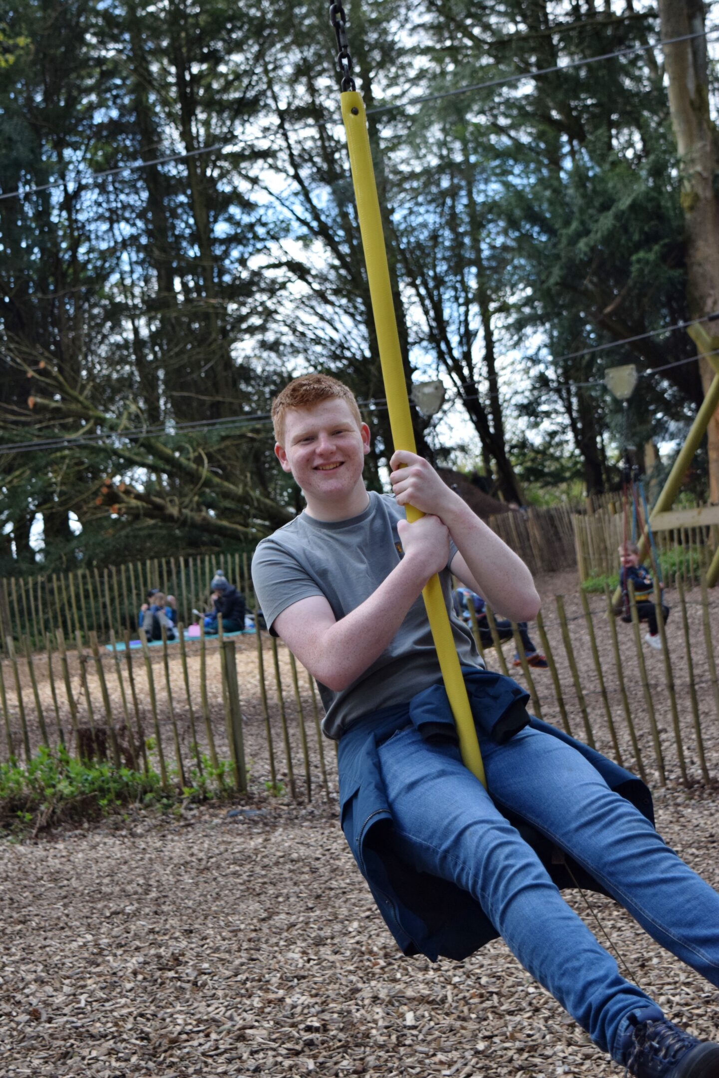 Ben on the zipwire in the Lost Castle adventure playground