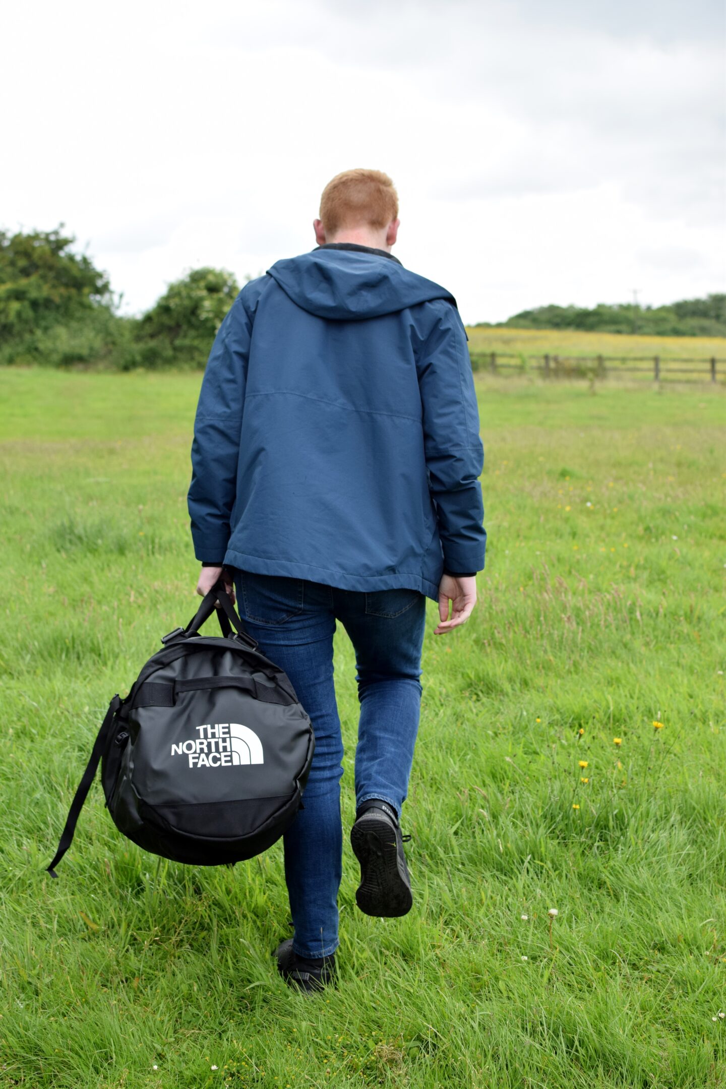 Ben carrying North Face Duffle Bag