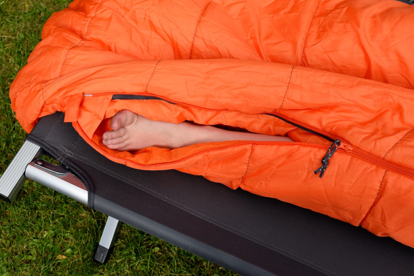 Choose a sleeping bag with a two way zip to let some air to your toes!