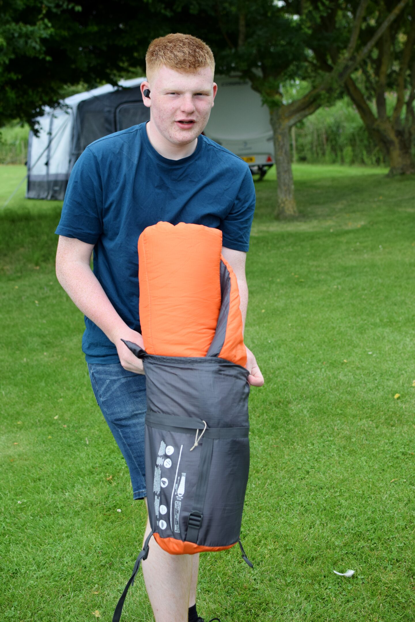 Putting a sleeping bag into its stuff sack