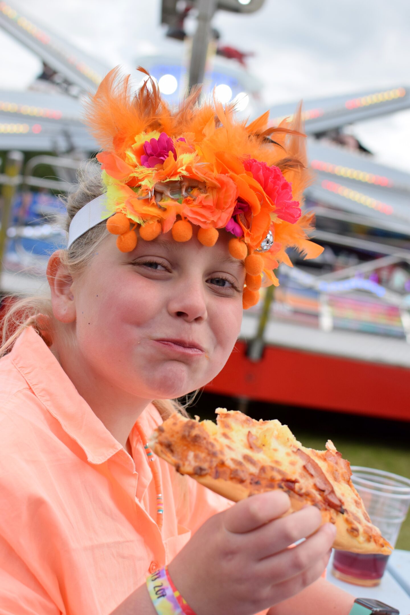 Amy eating a slice of pizza at Hardwick Festival
