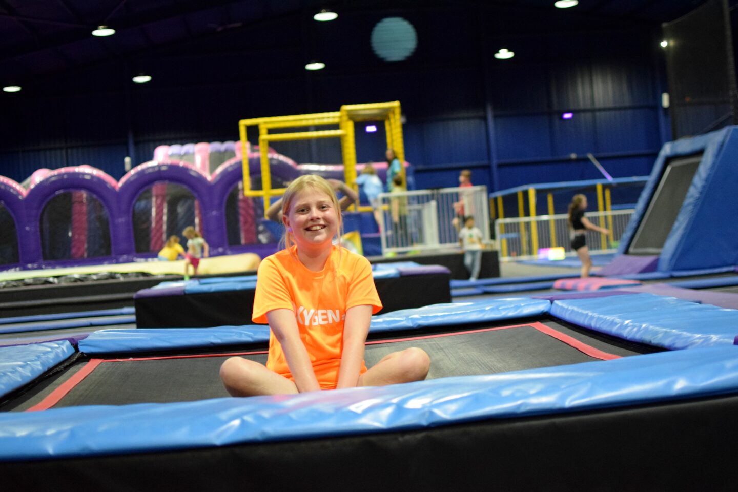 Amy sat on a trampoline at Oxygen Wilmslow