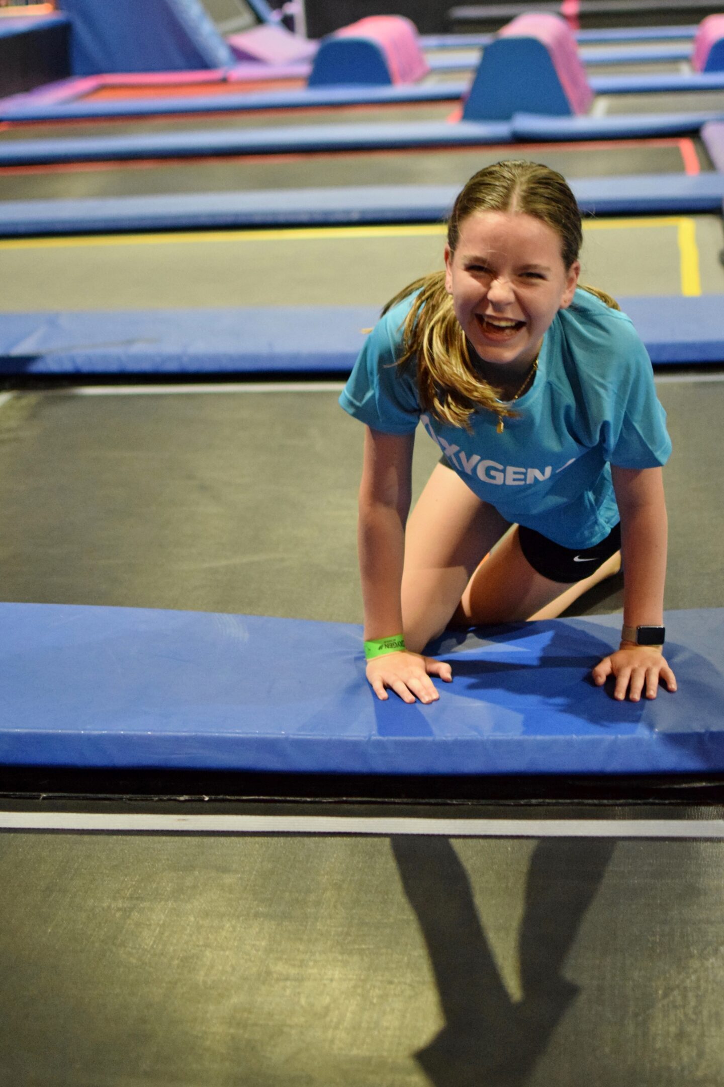 Chloe laughing on trampoline