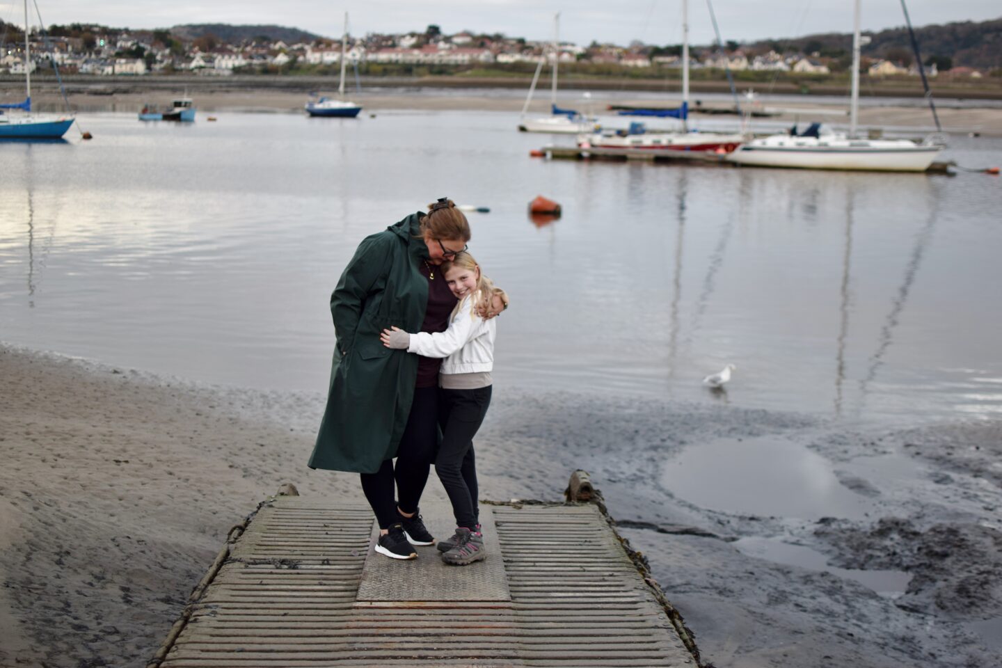 Colette and Amy sharing a cuddle on the quayside in Conwy