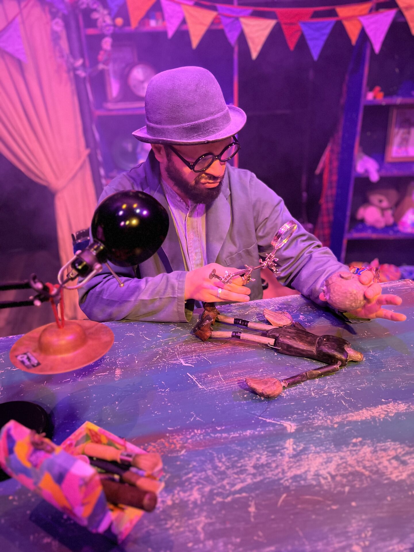 The Toymender spends his night fixing and repairing broken toys