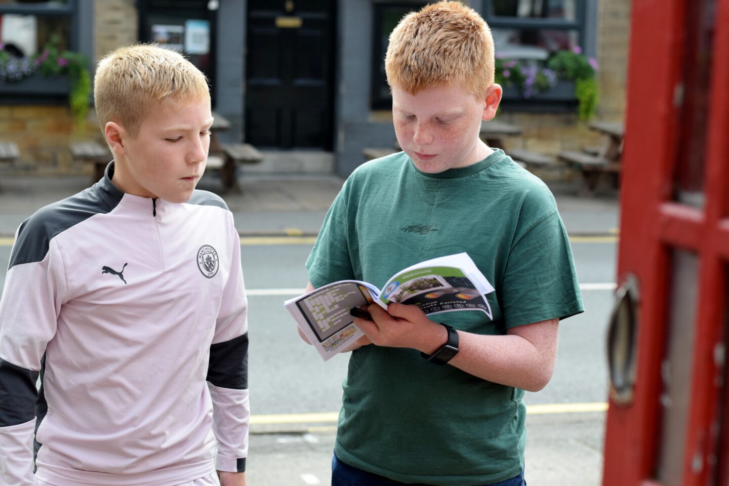 Ben and Finn completing a Treasure Trail in Uppermill - things to do with kids in Oldham