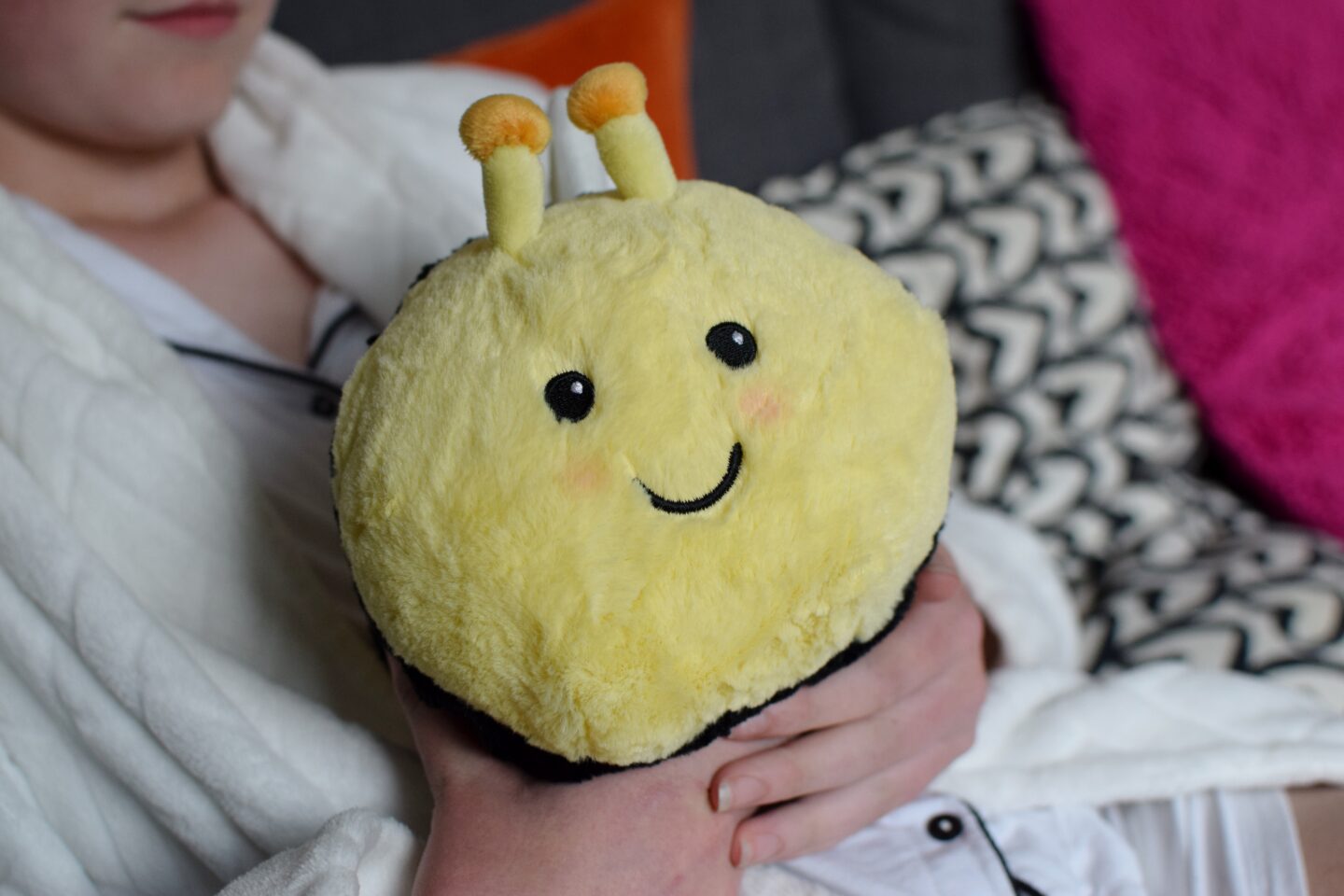 Warmies Honey Bee with cute face and rosy cheeks
