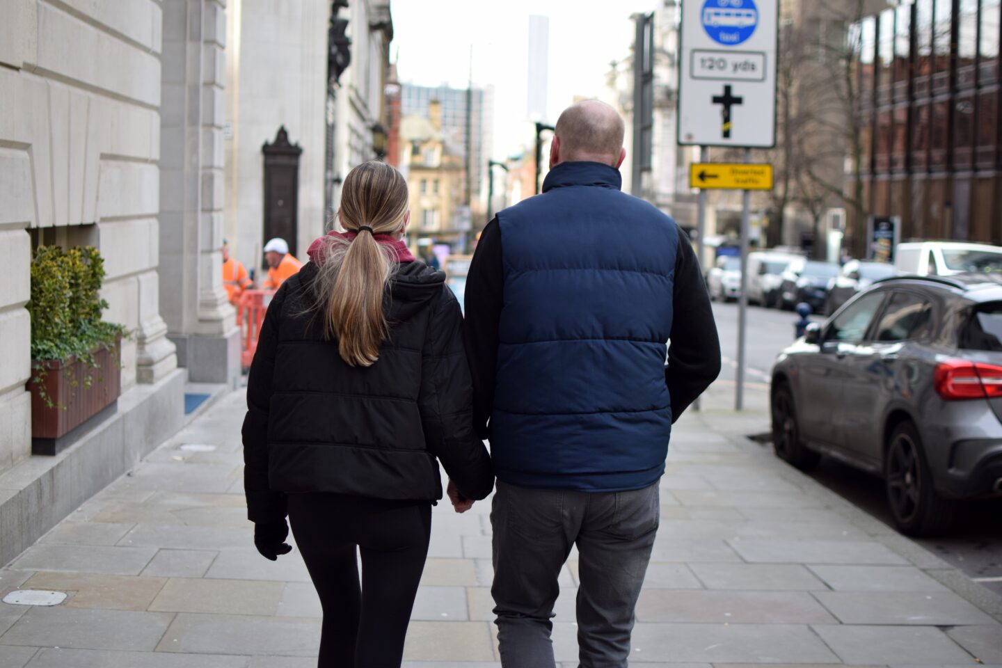 Dave and Chloe walking through Manchester