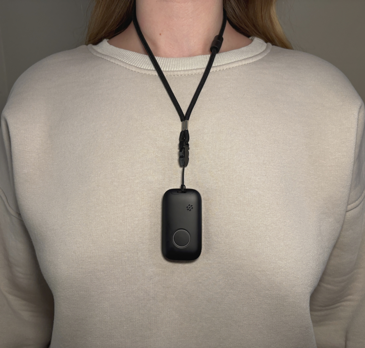 A wearable medical alert pendant that reassures a busy family carer